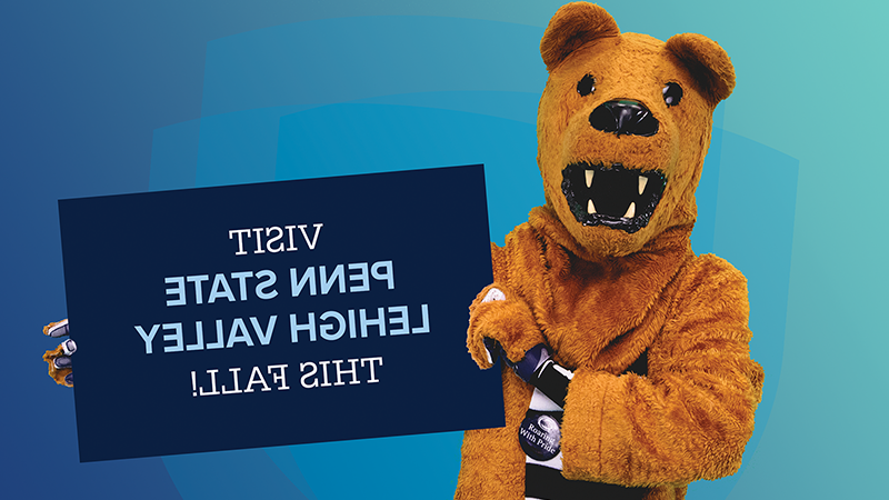 Lion mascot holding sign saying Visit Penn State Lehigh Valley this Fall!